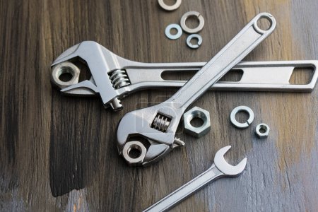 Photo for Close-up view of wrenches on wooden background - Royalty Free Image