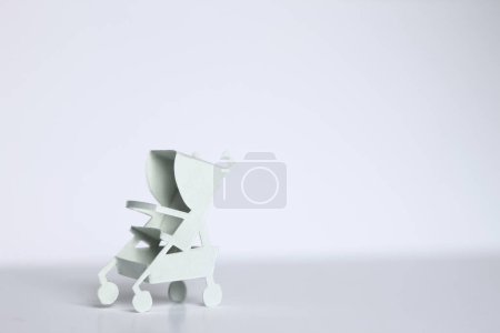 Photo for Cute white paper Baby stroller - Royalty Free Image