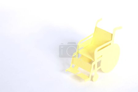 Photo for Paper wheelchair isolated on background, close up - Royalty Free Image