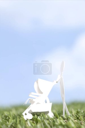 Foto de Recortar figura de mujer de papel con cochecito sobre fondo azul cielo. - Imagen libre de derechos