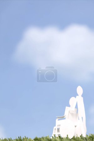 Photo for Cut out paper human figure carrying person on wheelchair, family care and support concept background - Royalty Free Image