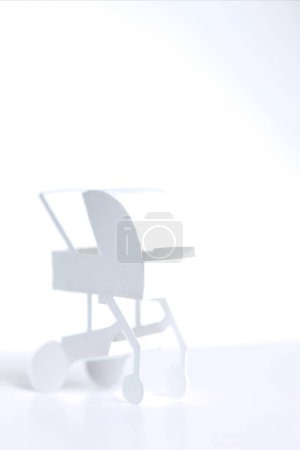 Photo for Small white paper Baby stroller - Royalty Free Image