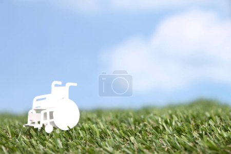 Photo for Close-up view of paper cut out wheelchair isolated on background - Royalty Free Image