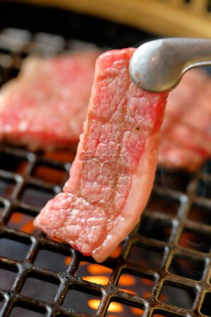 Photo for Close up view of delicious meat cooking on grill - Royalty Free Image