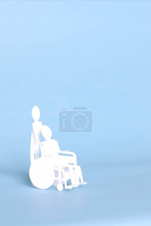 Photo for Paper cut out man on wheelchair - Royalty Free Image
