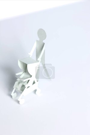 paper man with cute white paper Baby stroller