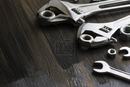 Photo for Set of wrenches and tools on a wooden background - Royalty Free Image