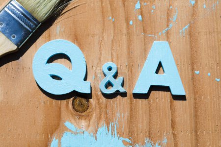 Photo for Q and a letters on a wooden background, questions and answers concept - Royalty Free Image