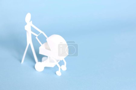 paper man with cute white paper Baby stroller