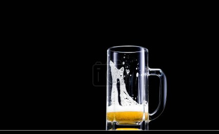 Photo for Beer glass with foam on a black background with space for text - Royalty Free Image