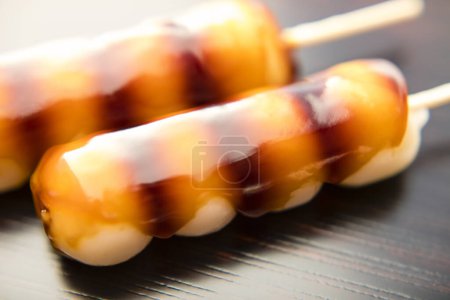 Photo for Dango, Japanese sweet dumplings made from rice flour mixed with uruchi rice flour and glutinous rice flour. It is different from the method of making mochi, which is made after steaming glutinous rice. - Royalty Free Image