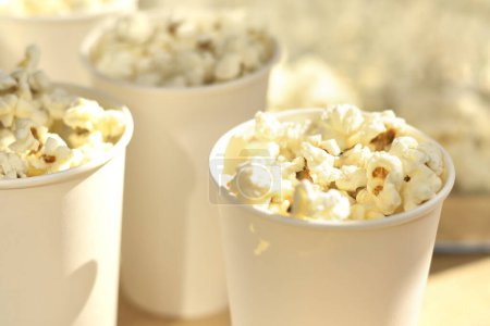 Photo for Tasty popcorn in paper cups - Royalty Free Image