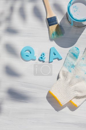 Photo for Q and a letter with gloves and paint, top view - Royalty Free Image