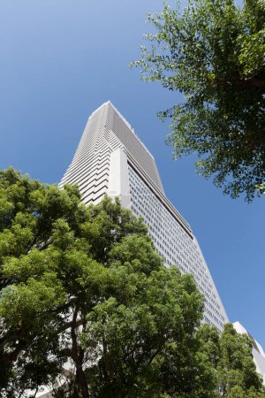 Photo for Modern apartment building and green trees in Tokyo, Japan - Royalty Free Image
