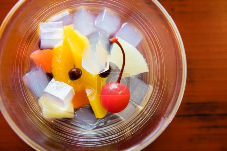 Photo for Close up view of tasty sweet dessert. Fruit salad with jelly and fruits - Royalty Free Image