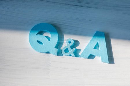 Photo for Q and a letters on white wooden surface, question and answers concept background - Royalty Free Image