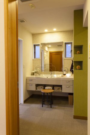 Photo for A bathroom with a double sink and a mirror - Royalty Free Image