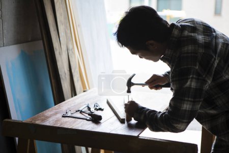 Photo for Close-up view of male carpenter working on table at industrial workshop - Royalty Free Image