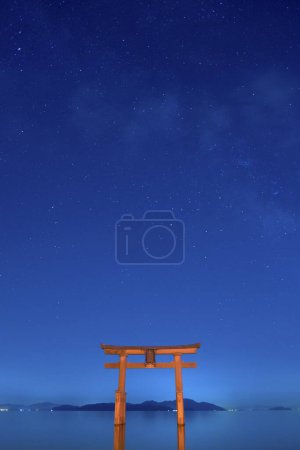 Photo for Shirahige Jinjia at night. Torii in Lake Biwa, Shirahige Shrine, Takashima, Shiga, Japan - Royalty Free Image