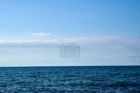 Photo for Beautiful seascape with calm sea and white clouds - Royalty Free Image