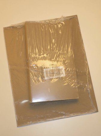 Photo for Cardboard box with tape on the floor - Royalty Free Image