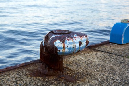 Photo for Old rusty metal bollard on the pier - Royalty Free Image