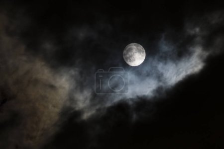 Photo for Night sky with moon in clouds - Royalty Free Image