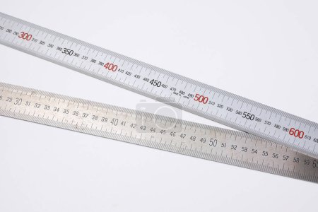Photo for Close-up view of measuring tapes isolated on white background - Royalty Free Image