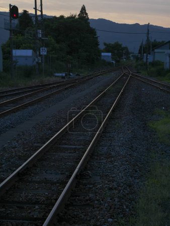 Photo for Railway track at sunset in the mountains - Royalty Free Image