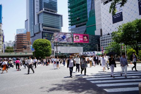 Photo for People crossing crosswalk in Tokyo - Royalty Free Image