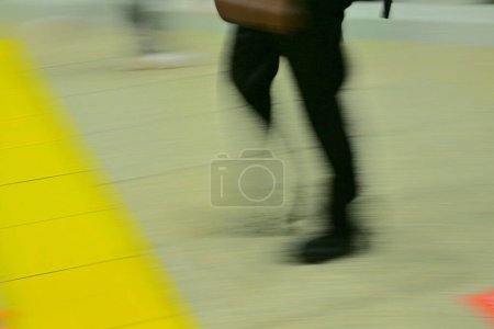 Photo for People moving by airport building, cropped section of blurred tourists. Travel Background - Royalty Free Image