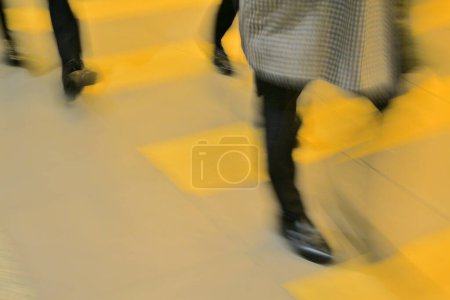Photo for People moving by airport building, cropped section of blurred tourists. Travel Background - Royalty Free Image