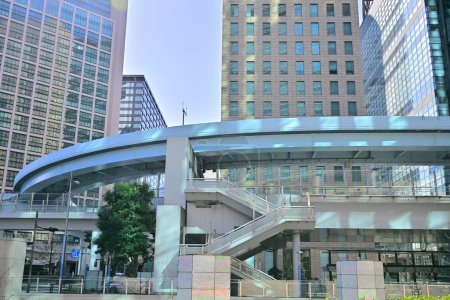 Pedi Shiodome shopping complex at the background of New Transit Yurikamome elevated railway line at Shiodome area of Minato. Tokyo. Japan