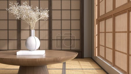 Foto de Mesa redonda de madera contra el podio, jarrón gris, flor ramo blanco en el libro en el piso tradicional tatami estera japonesa, ventana shoji a la luz del sol para la belleza asiática, moda, pantalla de producto 3D - Imagen libre de derechos