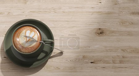 Téléchargez les photos : Vue du dessus de la belle forme de coeur latte art en vert sauge tasse à café, soucoupe sur table en bois avec espace vide à la lumière du soleil dans le café pour l'amour, détente, santé, énergie produit fond 3D - en image libre de droit