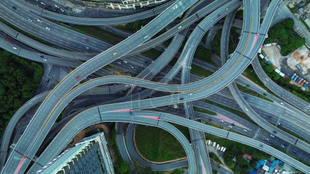 Photo for Aerial view of the expressway in Malaysia in the city of Kuala Lumpur, Penchala link. A birds eye view of a confusing traffic intersection. Architecture and urban planning of the capital. - Royalty Free Image