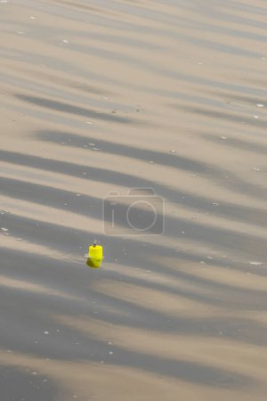 Photo for Fishing bobber in water with soft waves. High quality photo - Royalty Free Image