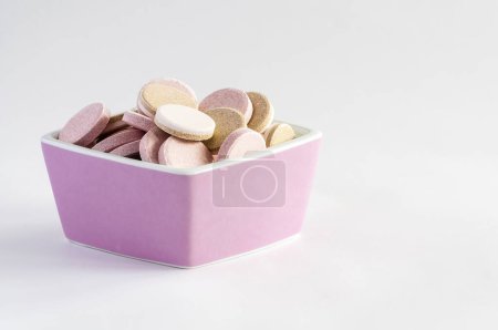 Photo for Pills in bowl isolated on white - Royalty Free Image