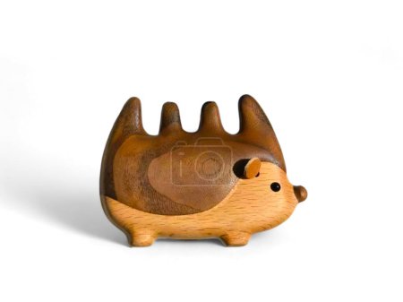 Decorated miniature hedgehog made of wood on a white background