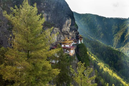 Photo for Scenic view of the sacred Paro Taktsang monastery (Tigers Nest buddhist temple) on the cliffside of Paro valley in Bhutan - Royalty Free Image