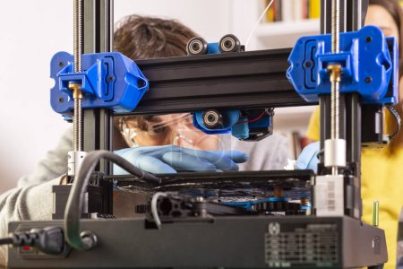 Modern 3D printer printing figure close-up macro