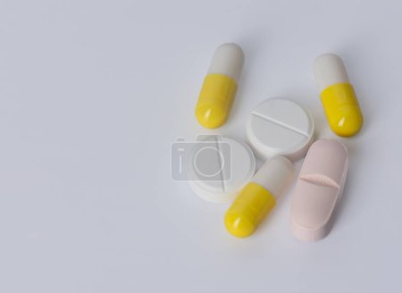 Photo for Tablets and capsules closeup on white background. - Royalty Free Image