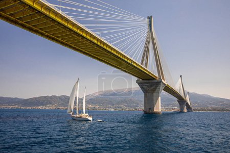 Photo for The sailboat passes under the Rio-Antirrio Bridge or Charilaos Trikoupis Bridge, photo taken from the boat. Horizontal. - Royalty Free Image