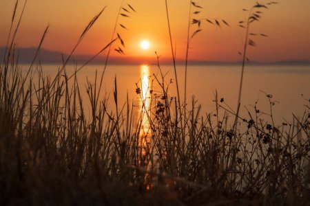 Sunrise over Tigani Beach near Tyros town, Peloponnese, Myrtoan Sea, GREECE in summer morning. Horizontal. Close-up.