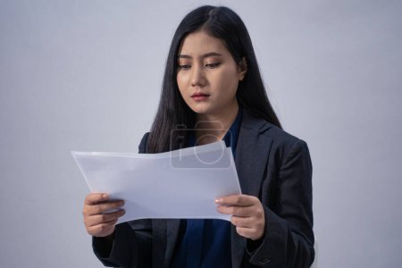 Photo for Portrait of a young Asian business woman with white sheet, studio shot, business concept, isolated background - Royalty Free Image