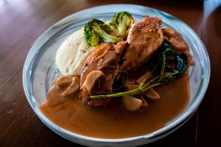 Photo for Indulge in tender chicken breast with a variety of delightful sauces. An unforgettable dining experience with a symphony of flavors awaits you - Royalty Free Image