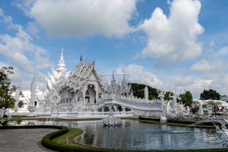 Photo for Place of worship, Wat Rong Khun also known as the white temple, located in Chiang Rai Province, Thailand. A unique style Buddhist temple with the bridge of the cycle of rebirth - Royalty Free Image
