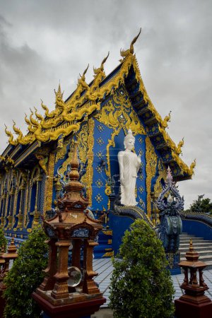 Photo for Wat Rong Suea Ten or The Blue Temple translates as House of the dancing tiger A monumental, modern Buddhist temple distinguished by its vivid blue coloring & elaborate carvings in Chiang Rai Province - Royalty Free Image