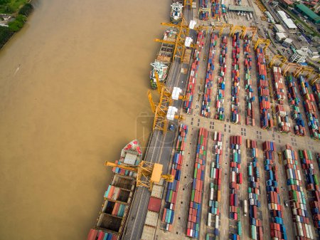 Photo for Aerial View Above the Bangkok Dockyard by the Chao Phraya River with Cargo Ships Waiting to be Upload and Offload Cargo Containers - Royalty Free Image