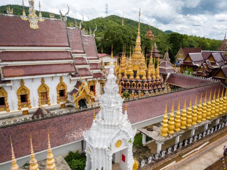 Photo for Buddhist Temple Wat Phra That Suthon Mongkon Khiri features beautiful architectures that are inspired by the ancient, traditional ordination hall (Ubosot) and reclining Buddha statue - Royalty Free Image
